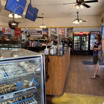 Yia Yia Kitchen - a woman standing in front of the counter - Bakeries Near Me - Savannah, Georgia Yia Yia Kitchen - a woman standing in front of the counter - Bakeries Near Me - Savannah, Georgia