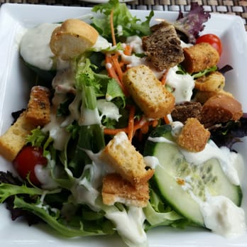 31 Hundred - a plate of salad with croutons and dressing - New American Near Me - Toledo, Ohio