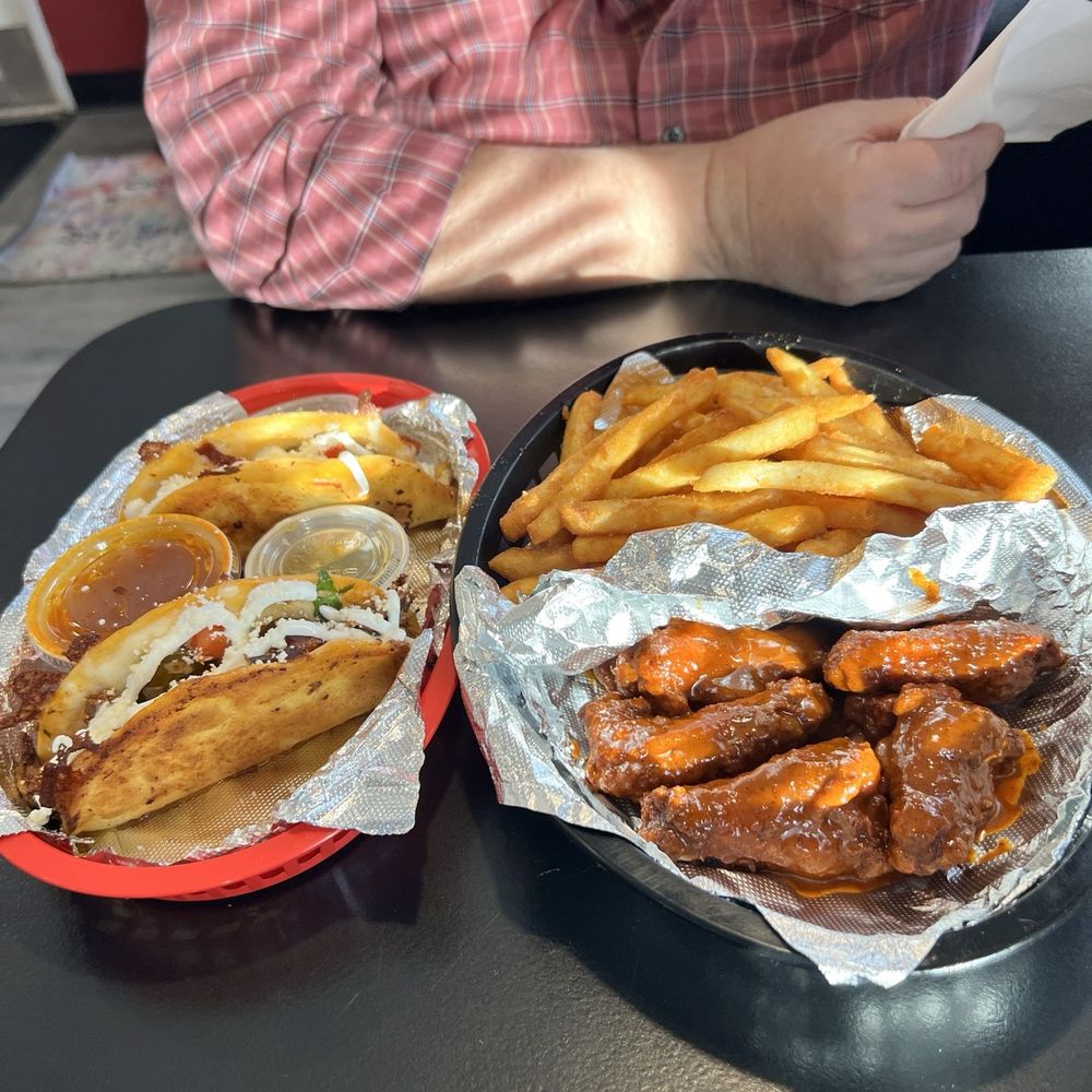 Loaded lamb and chicken birria tacos , spicy wings with fries Loaded lamb and chicken birria tacos , spicy wings with fries