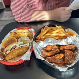 Loaded lamb and chicken birria tacos , spicy wings with fries Loaded lamb and chicken birria tacos , spicy wings with fries