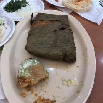 Restaurante Arbol Del Tule - Wrapped tamal (you can see the dry masa peeping through). On the top right is the chicken taco. - Mexican Near Me - Anaheim, California Restaurante Arbol Del Tule - Wrapped tamal (you can see the dry masa peeping through). On the top right is the chicken taco. - Mexican Near Me - Anaheim, California
