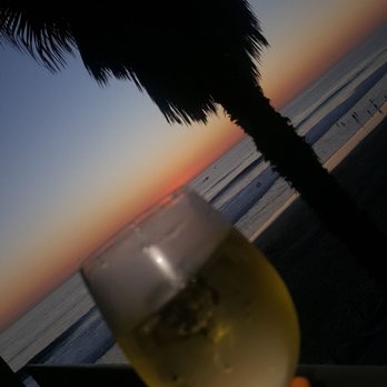Beach Terrace - Having a glass a wine while enjoying a beautiful sunset. - Hotels Near Me - Carlsbad, California Beach Terrace - Having a glass a wine while enjoying a beautiful sunset. - Hotels Near Me - Carlsbad, California