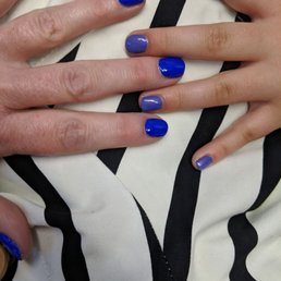 Mother daughter manis while we wait for our flight. Turned out beautifully . Great massage chairs while we waited for our nails to dry.