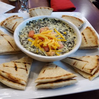 The Derrick Bar - Spinach and artichoke dip sub pita instead of chips. Very salty. - American Near Me - Houston, Texas The Derrick Bar - Spinach and artichoke dip sub pita instead of chips. Very salty. - American Near Me - Houston, Texas