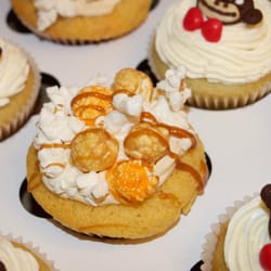 Better than Yia Yia's - Chicago Remix - fluffy cornmeal cupcakes topped with Caramel buttercream, fresh popcorn, and Caramel Drizzle.
