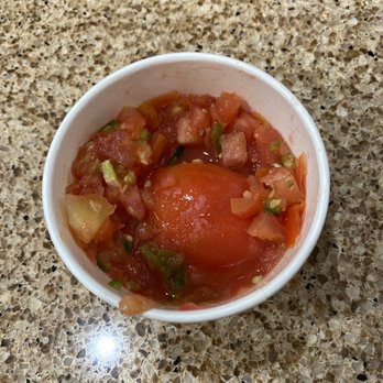 El Pollo Loco - Half tomato not chopped included in the salsa. Did they not see this when they were putting it in the cup??? - Fast Food Near Me - Brea, California