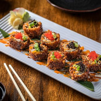 Zoku Sushi - a plate of sushi with chopsticks - Japanese Near Me - Chicago, Illinois Zoku Sushi - a plate of sushi with chopsticks - Japanese Near Me - Chicago, Illinois