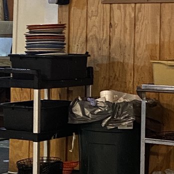 Jail House Bar & Grill - a stack of plates on a cart - Bars Near Me - Rocksprings, Texas