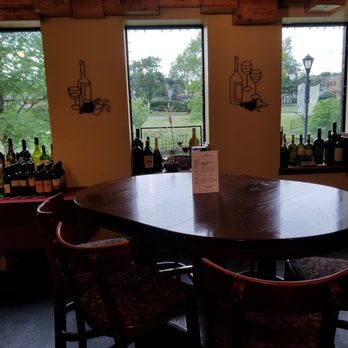 Wine With Me - a table with chairs and bottles of wine - Beer, Wine & Spirits Near Me - Itasca, Illinois