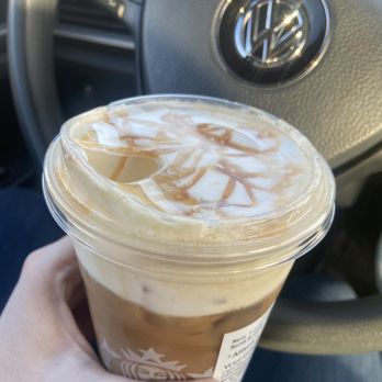 Starbucks - a hand holding a cup of iced coffee - Coffee & Tea Near Me - Chattanooga, Tennessee Starbucks - a hand holding a cup of iced coffee - Coffee & Tea Near Me - Chattanooga, Tennessee
