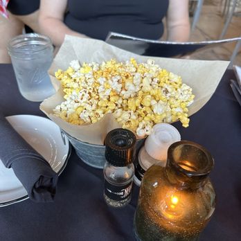 Moonshine Grill - Complementary Popcorn - We were served this unique popcorn when seated!!  It had a tasty seasoning on it that was so unexpected and great! - Southern Near Me - Austin, Texas