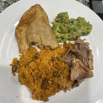 Caliente Deli - Pernil//Roasted Pork/yellow rice and beans, avocado salad, and a half eaten chicken empanada! I couldn't resist, lol! - Delis Near Me - New Haven, Connecticut
