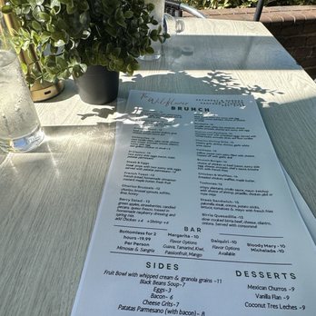 The Wildflower - Outside seating while the Saturday marker is going on! - Cocktail Bars Near Me - Sanford, Florida