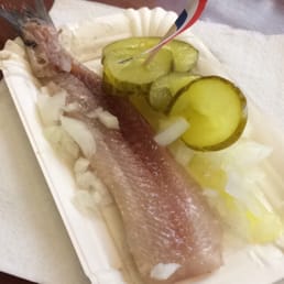 Great pickled herring with sliced pickles and diced onions.
