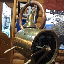 a large copper bell on a stand