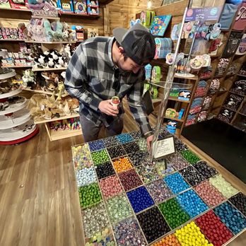 Fritztown Mercantile - Hubby playing with marble selection - Accessories Near Me - Fredericksburg, Texas