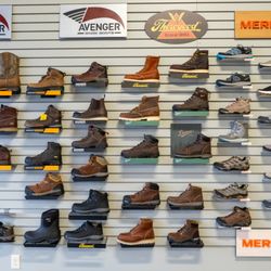 ShoeLab Orthotics & Footwear - Display of Avenger boots and shoes, Thorogood boots, and Merrell shoes and boots.