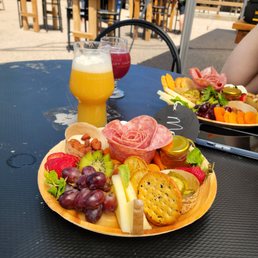 a plate of food and a glass of beer