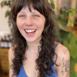 Hair Creations - Naturally curly hair with Birkin bangs crafted by Janelle.