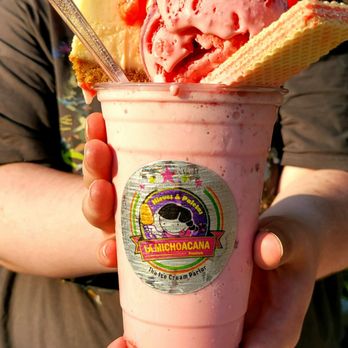 La Michoacana Premium - a woman holding a cup of ice cream - Ice Cream & Frozen Yogurt Near Me - Raleigh, North Carolina