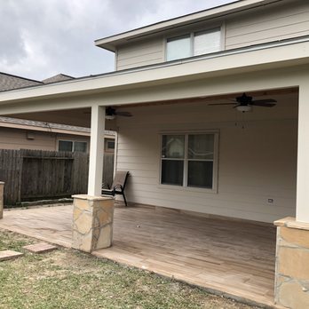 Legacy Home Services - a covered patio with a ceiling fan - Patio Coverings Near Me Legacy Home Services - a covered patio with a ceiling fan - Patio Coverings Near Me