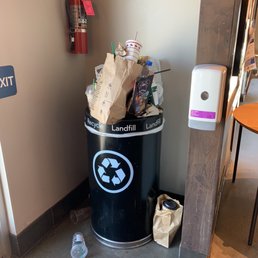 Overflowing trash can.