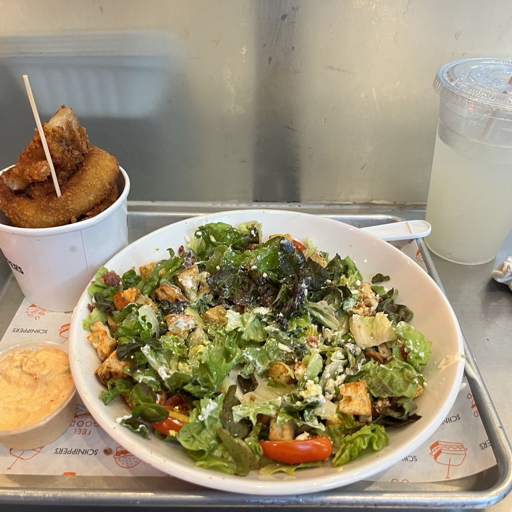 Schnipper's - Cobb salad with ranch dressing and crispy onion rings, and lemonade - Burgers Near Me - New York, New York