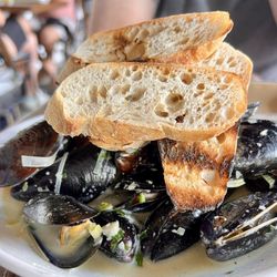 Neuse River Brewing & Brasserie - White wine and leeks with mussels. We ordered extra bread to sop up the remaining broth.