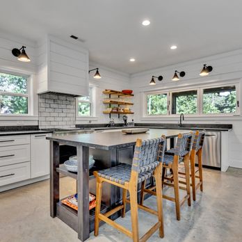 Cornerstone Construction - Bright, modern kitchen with large island, clean white cabinetry, and warm wood accents--perfect for gathering and entertaining. - General Contractors Near Me - Arley, Alabama Cornerstone Construction - Bright, modern kitchen with large island, clean white cabinetry, and warm wood accents--perfect for gathering and entertaining. - General Contractors Near Me - Arley, Alabama