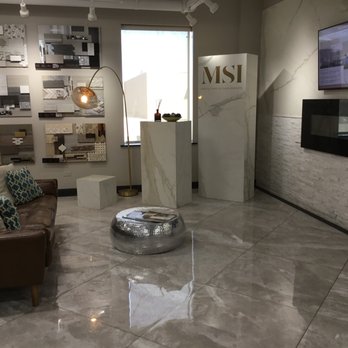 MSI - a living room with a couch, coffee table, and television - Flooring Near Me - Elk Grove Village, Illinois