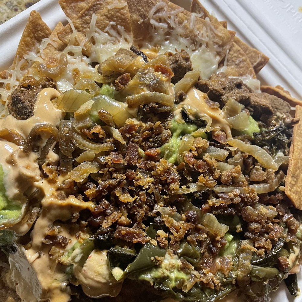 Man vs Fries - Lots of things thrown on top of some hard chips. Actually not much cheese tho and dry af! - Food Delivery Services Near Me - Austin, Texas Man vs Fries - Lots of things thrown on top of some hard chips. Actually not much cheese tho and dry af! - Food Delivery Services Near Me - Austin, Texas
