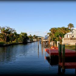 Silver Sands Villas - Canal view from docks, back in the garden area by villas #11 and #12