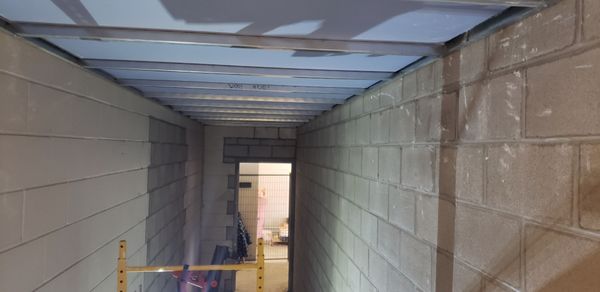 shaft wall fire rated ceiling in an exit hallway - one of 2 hallways in a public commercial space requiring a special wall system to give an fire rating as keep it safe for egress in an emergency shaft wall fire rated ceiling in an exit hallway - one of 2 hallways in a public commercial space requiring a special wall system to give an fire rating as keep it safe for egress in an emergency