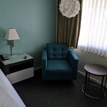 Kings Inn San Diego - Next to bed to watch the TV and extremely comfy not sure what it's called but couch for one adult. - San Diego, CA