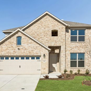 Lillian Homes - The exterior of a brick two-story home. - Home Developers Near Me - Waxahachie, Texas Lillian Homes - The exterior of a brick two-story home. - Home Developers Near Me - Waxahachie, Texas
