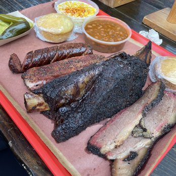 Terry Black's Barbecue - Top to bottom: sausage, pork rib, beef rib, brisket - Barbeque Near Me - Austin, Texas Terry Black's Barbecue - Top to bottom: sausage, pork rib, beef rib, brisket - Barbeque Near Me - Austin, Texas