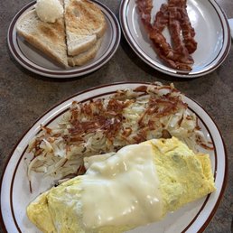 Fresh Mushroom and Cheese Omelette ($14.99). Came with toast. I also ordered a side of bacon ($4.99/4 strips).