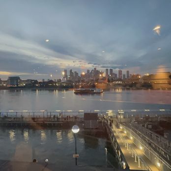 Zizzi - View of the sunset over city from the restaurant table. - Italian Near Me - London, LND Zizzi - View of the sunset over city from the restaurant table. - Italian Near Me - London, LND