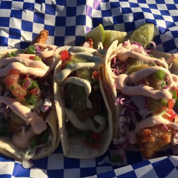 Scratch Cookery - Fish tacos. Orange sauce on the ends and jalapeño cream in the middle.  AMAZING - Food Trucks Near Me - San Jose, California