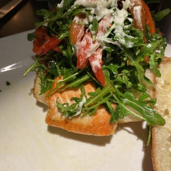 Volterra - What a great value salmon burger with Caesar or potato fingers Happy Hour menu - Italian Near Me - Kirkland, Washington