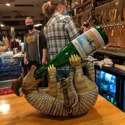 a man pouring a bottle of beer a man pouring a bottle of beer