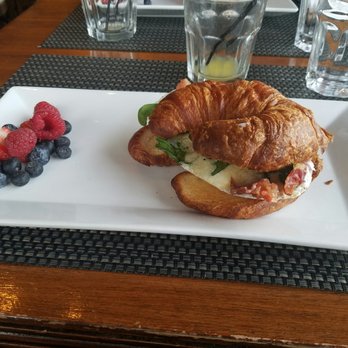 Saltwater Cafe - Toasted croissant with a poached egg, Asiago, bacon, and spinach. - New American Near Me - Point Roberts, Washington