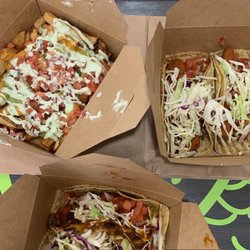 50 Pesos - 2 tacos each + street fries