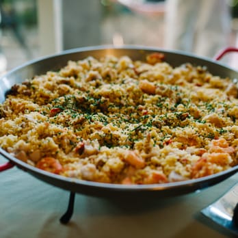 Jane Hammond Events - Fantastic Spanish Paella, with Chicken, Andouille sausage, Prawns, and calamari in saffron rice. - Party & Event Planning Near Me Jane Hammond Events - Fantastic Spanish Paella, with Chicken, Andouille sausage, Prawns, and calamari in saffron rice. - Party & Event Planning Near Me