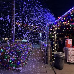 9697 Locust Ave. Christmas Lights - Snow for the kids, popcorn, hot coco, even elotes. Lol alsoooo had a space for kids to write letters to Santa. Love that