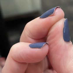 Madison Nail Lounge - See pinky and ring finger, polish does not go to the end of the nail tip or all the way to the edges