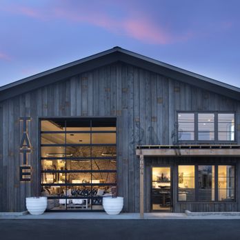 Tate Interiors - a rustic barn with a dining area - Interior Design Near Me - Whitefish, Montana Tate Interiors - a rustic barn with a dining area - Interior Design Near Me - Whitefish, Montana