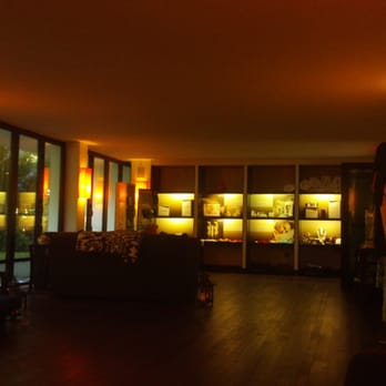 The Spa At Omphoy - Waiting area has couch, cushy chairs, and lounge bed. Very nice with peaceful music. - Massage Therapy Near Me - Palm Beach, Florida The Spa At Omphoy - Waiting area has couch, cushy chairs, and lounge bed. Very nice with peaceful music. - Massage Therapy Near Me - Palm Beach, Florida