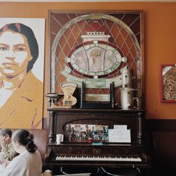 a woman sitting at a piano