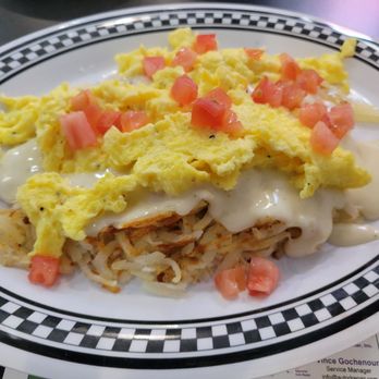 Trish's Red Bird Cafe - All about the base (hash browns topped with eggs your way, queso and diced tomatoes) - Breakfast & Brunch Near Me - Dayton, Indiana Trish's Red Bird Cafe - All about the base (hash browns topped with eggs your way, queso and diced tomatoes) - Breakfast & Brunch Near Me - Dayton, Indiana
